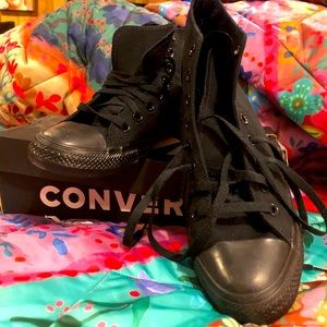 Brand new, never worn converse Chuck Taylor black hi tops. Womens size 7.5